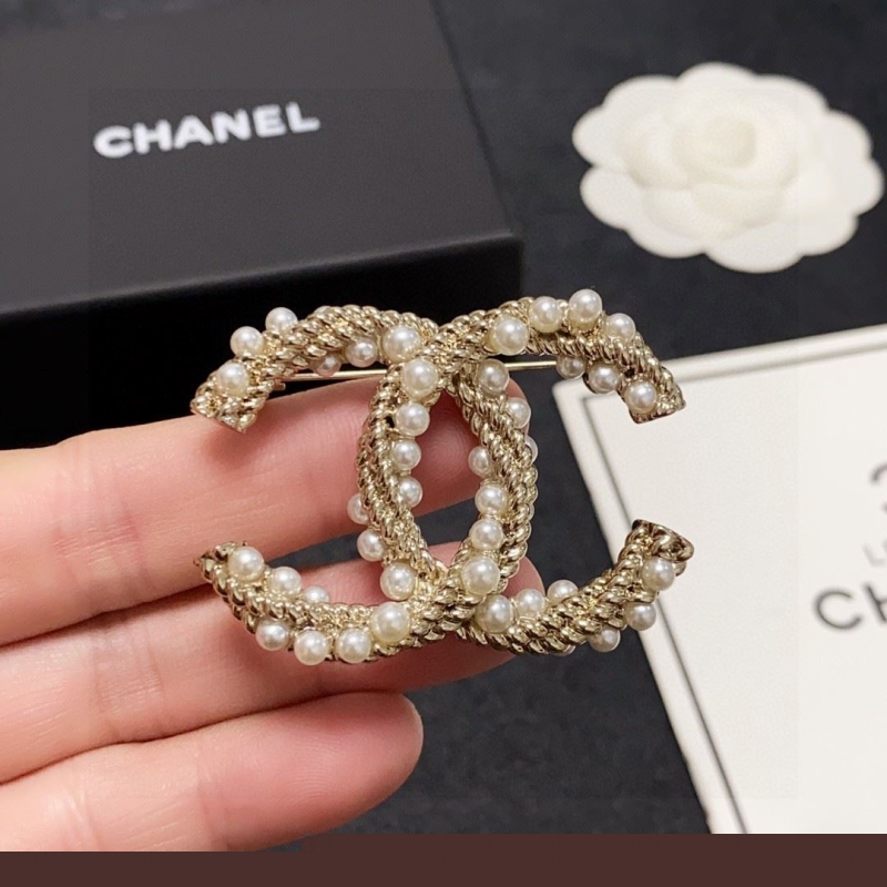 Ch*el brooches